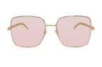 Gucci 724 sunglasses with black frames and tinted lenses, displayed on a website screenshot.