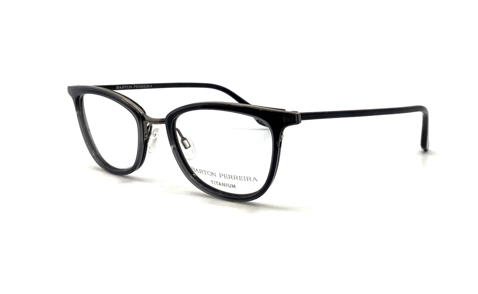 Screenshot of Betty sunglasses by Barton Perreira showing stylish black frames and tinted lenses.