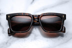 Jacques Marie Mage Torino sunglasses with tortoise frames and dark lenses, stylish eyewear on a clean background.