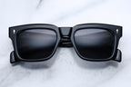 Jacques Marie Mage Torino Apollo sunglasses with sleek black frames and dark tinted lenses, front view.