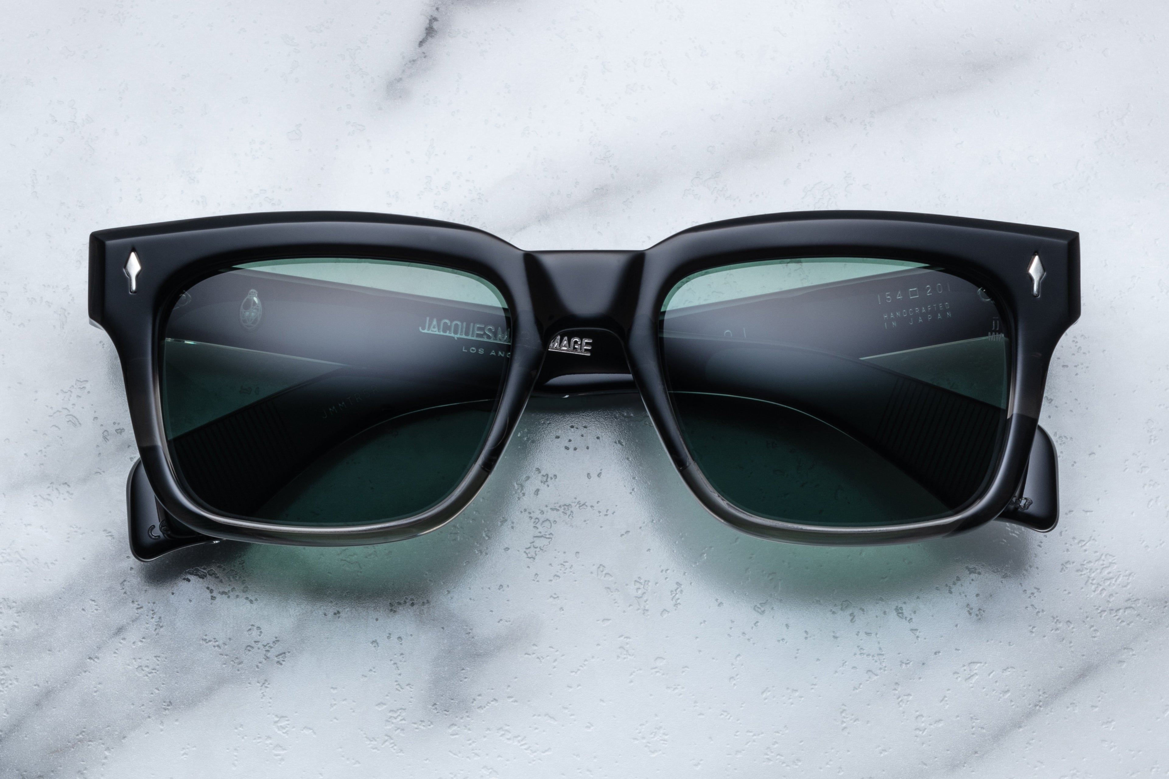 Jacques Marie Mage Torino black fade sunglasses with round frames and tinted lenses, front view showing stylish design.