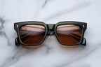 Jacques Marie Mage Torino Borneo sunglasses with rounded frames and tinted lenses, front view showing stylish design.