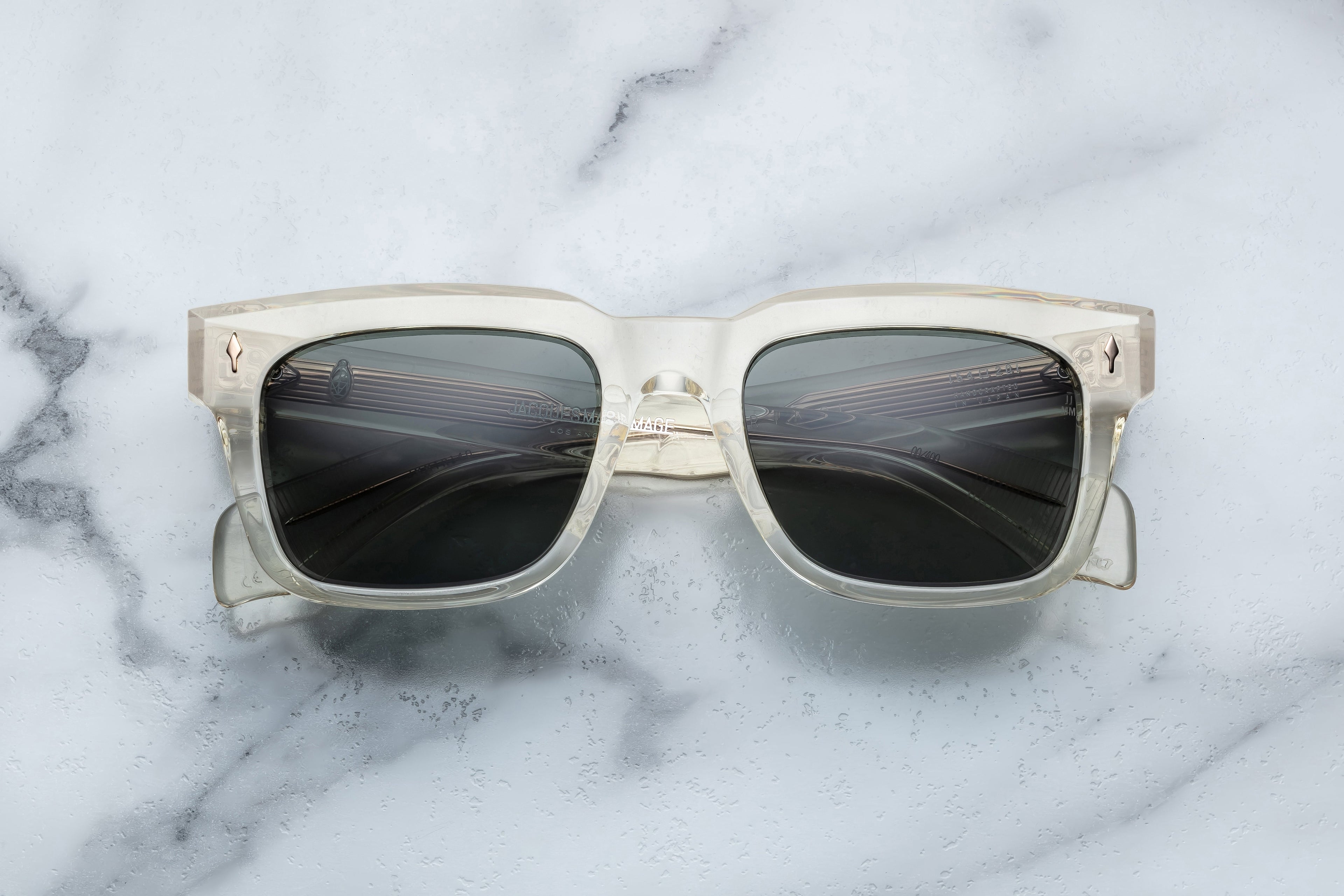 Jacques Marie Mage Torino sunglasses with bold black frames and tinted lenses, front view showing stylish design.