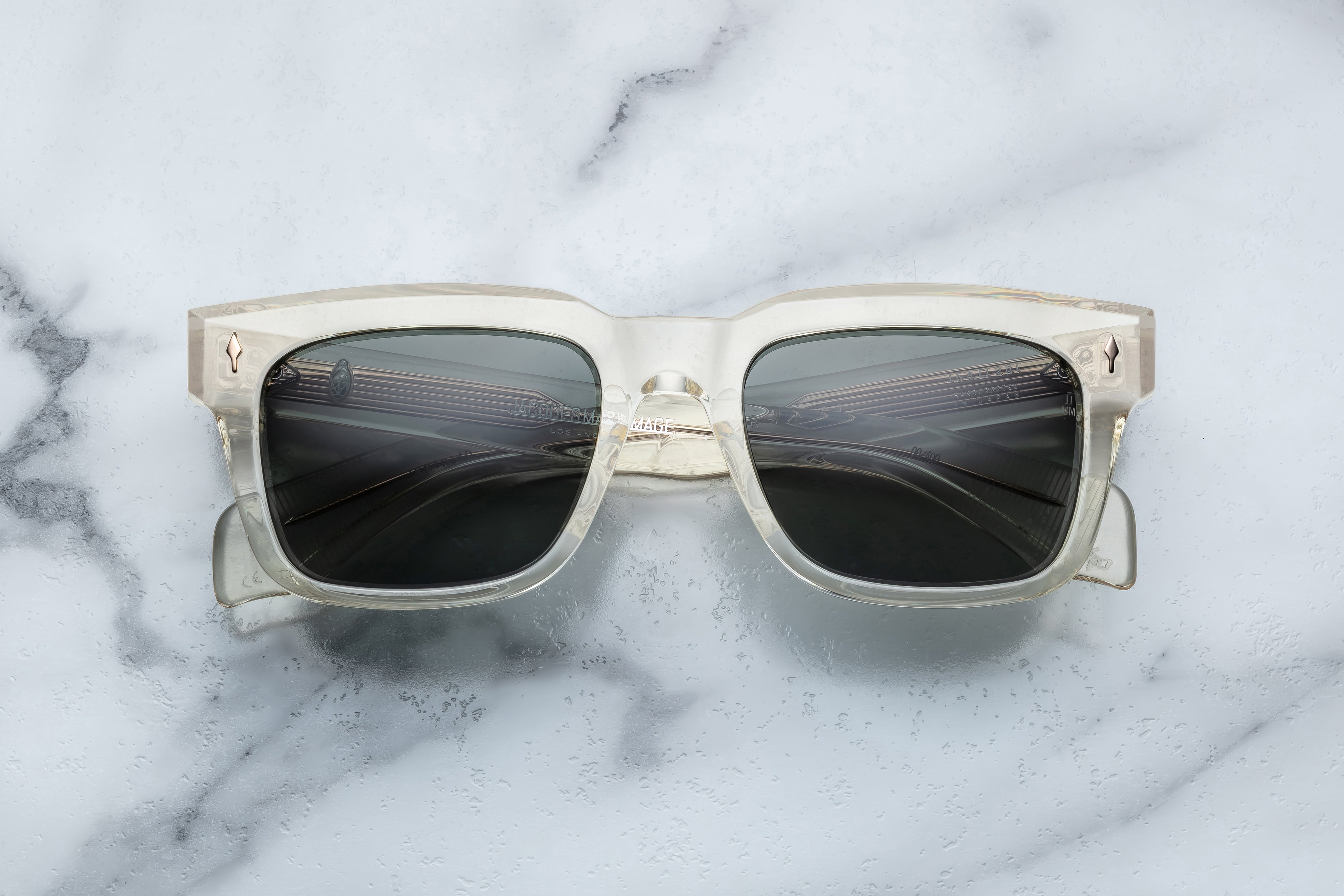 Jacques Marie Mage Torino sunglasses with bold black frames and tinted lenses, front view showing stylish design.