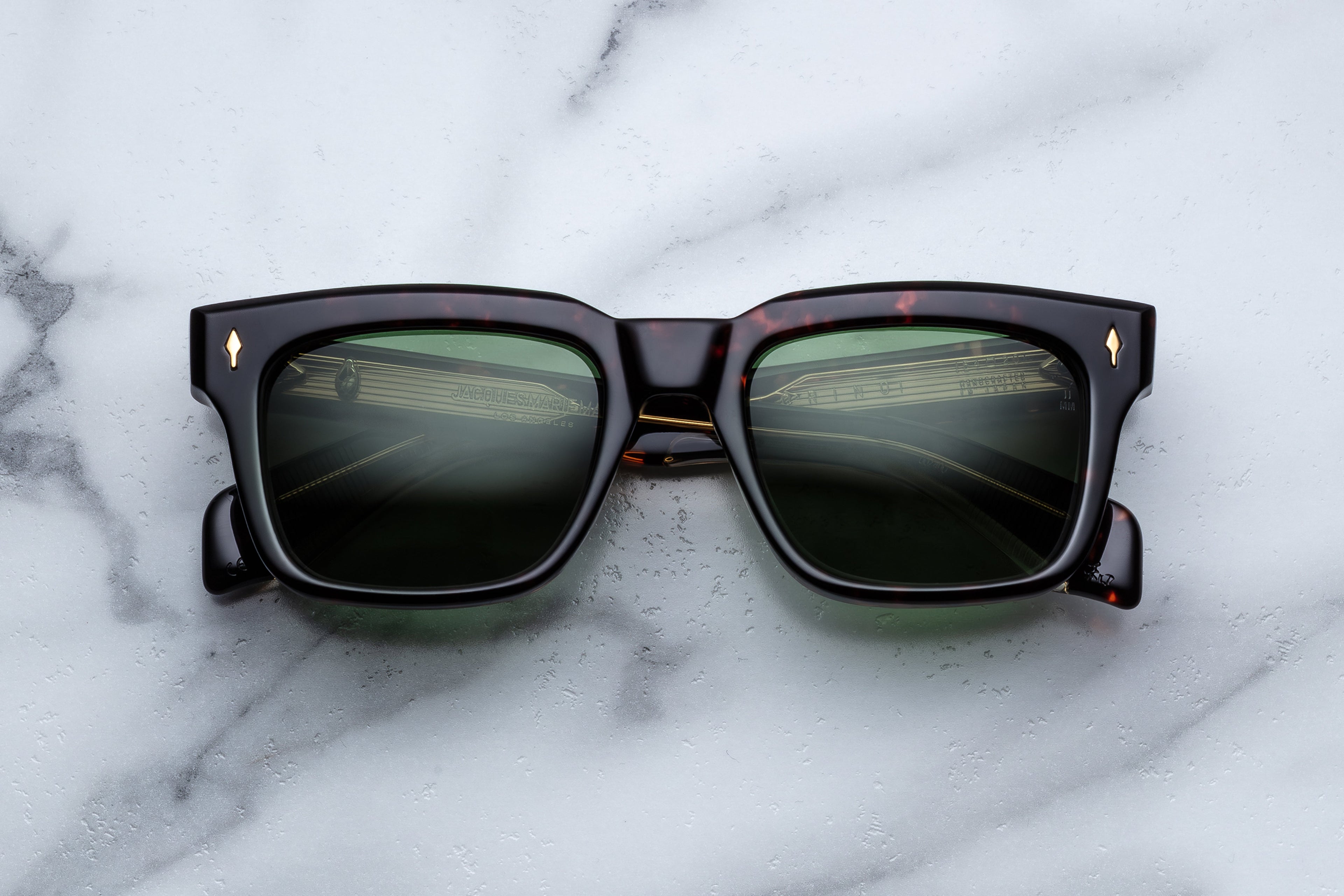 Jacques Marie Mage Torino sunglasses with round frames and clear lenses, front view showing sleek, stylish design.