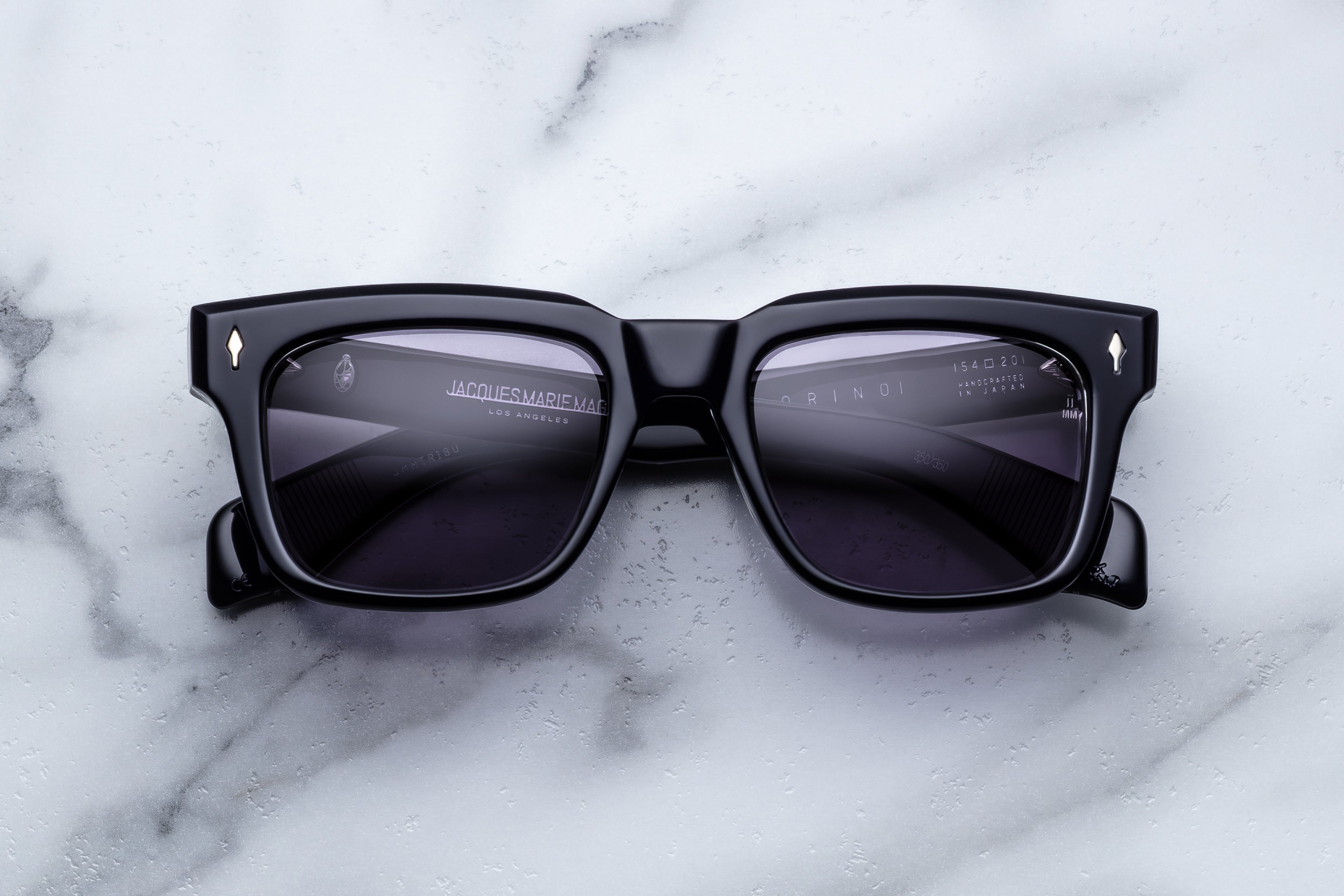Jacques Marie Mage Torino sunglasses with round frames and tinted lenses, front view showing stylish eyewear.