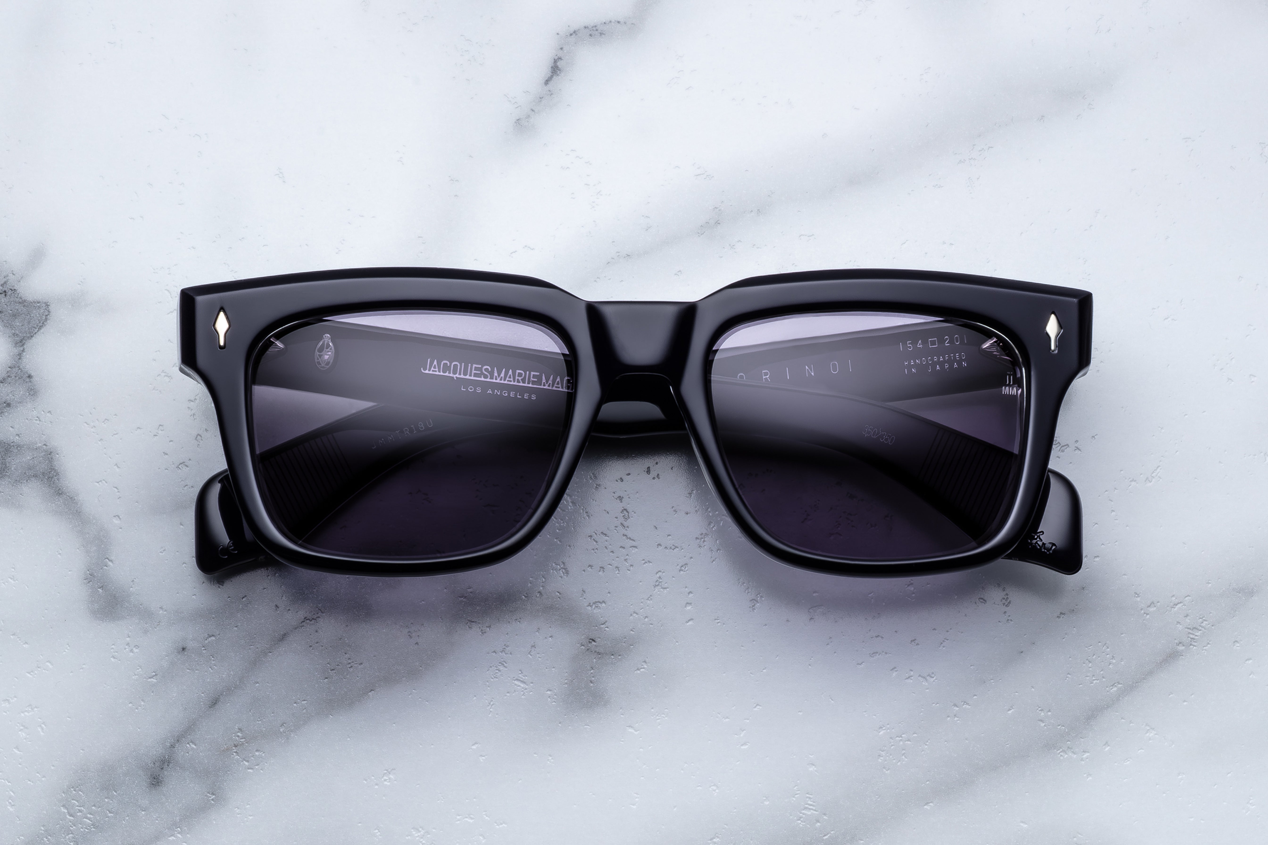 Jacques Marie Mage Torino sunglasses with round frames and tinted lenses, front view showing stylish eyewear.