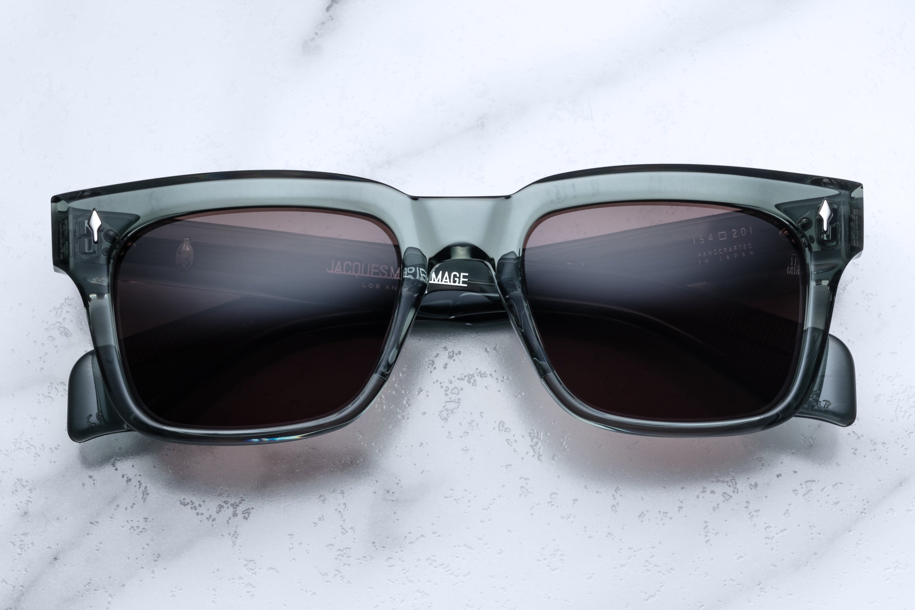 Jacques Marie Mage Torino Juniper sunglasses with round frames and tinted lenses, front view showing stylish design.