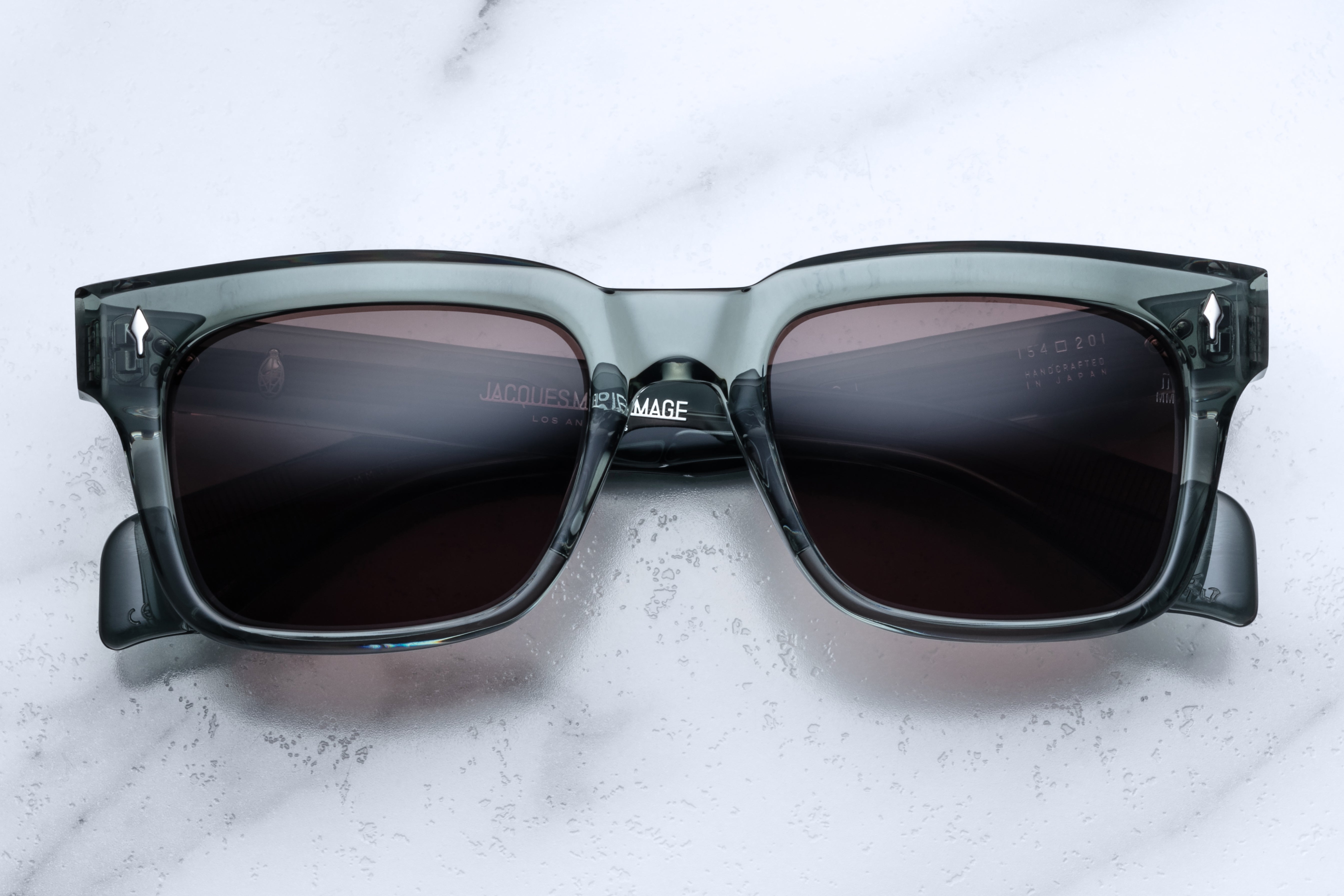 Jacques Marie Mage Torino Juniper sunglasses with round frames and tinted lenses, front view showing stylish design.