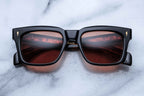 Jacques Marie Mage Torino Noir sunglasses with dark tinted lenses and sleek black frame shown from front view.