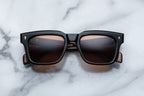 Jacques Marie Mage Torino NoirX sunglasses with black frames and tinted lenses, front view showing stylish design.