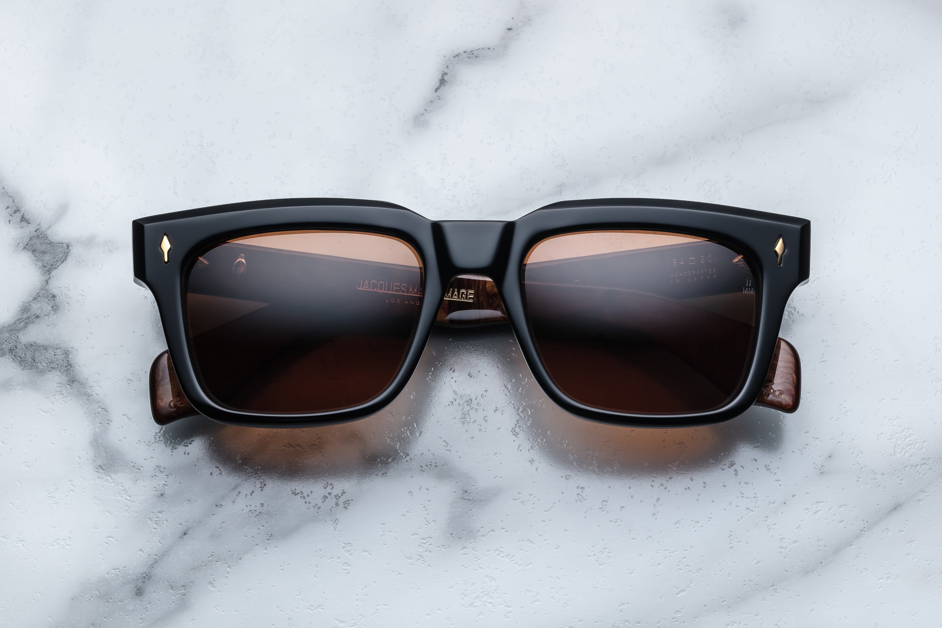 Jacques Marie Mage Torino NoirX sunglasses with black frames and tinted lenses, front view showing stylish design.