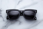 Jacques Marie Mage Torino Raven sunglasses with rounded frames and dark lenses, front view showing stylish design.