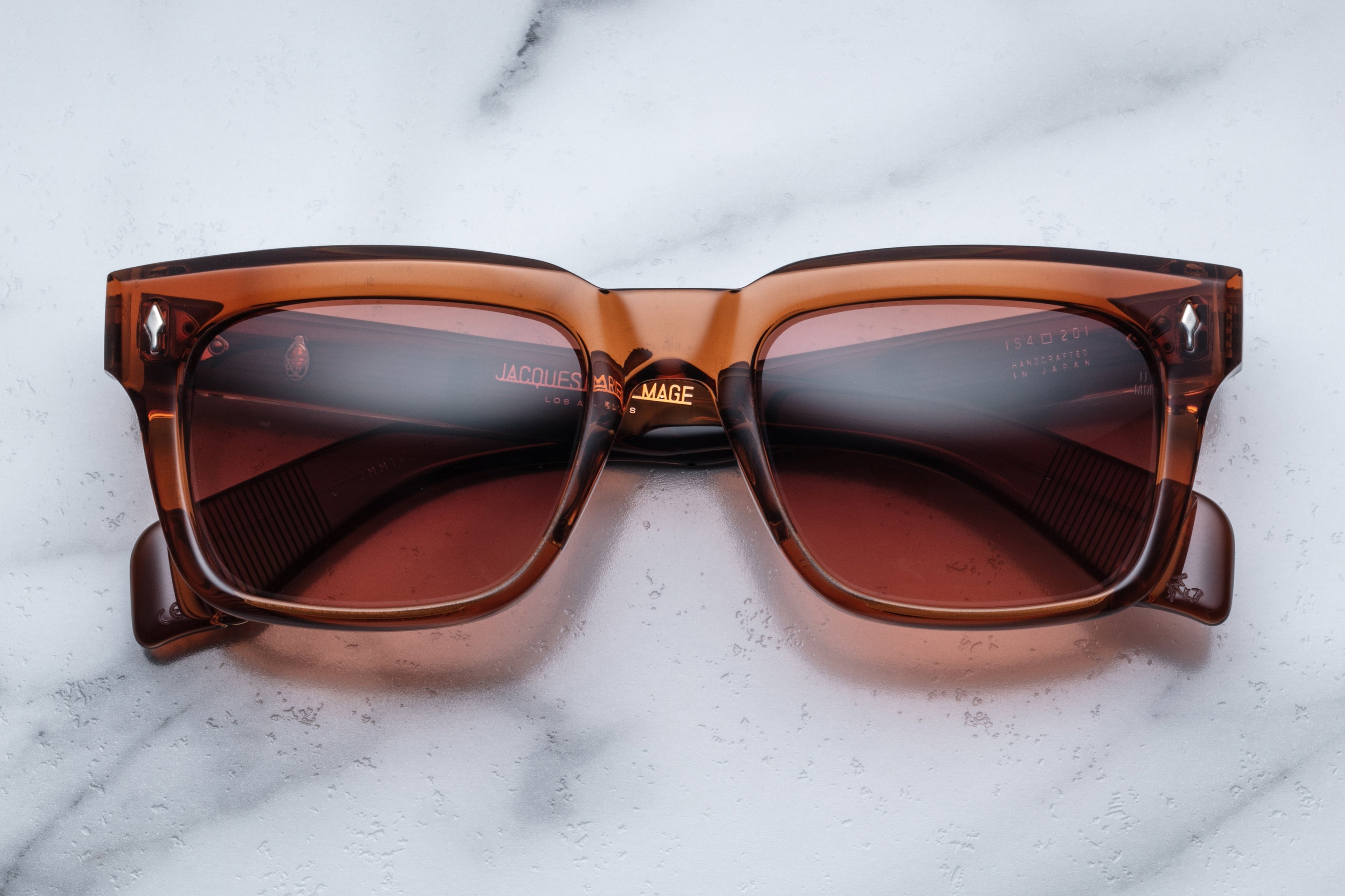 Jacques Marie Mage Torino Terra sunglasses with rounded frames and tinted lenses, front view showing stylish design.