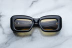Jacques Marie Mage VITO sunglasses with shadowed front view showcasing sleek black frames and stylish design.