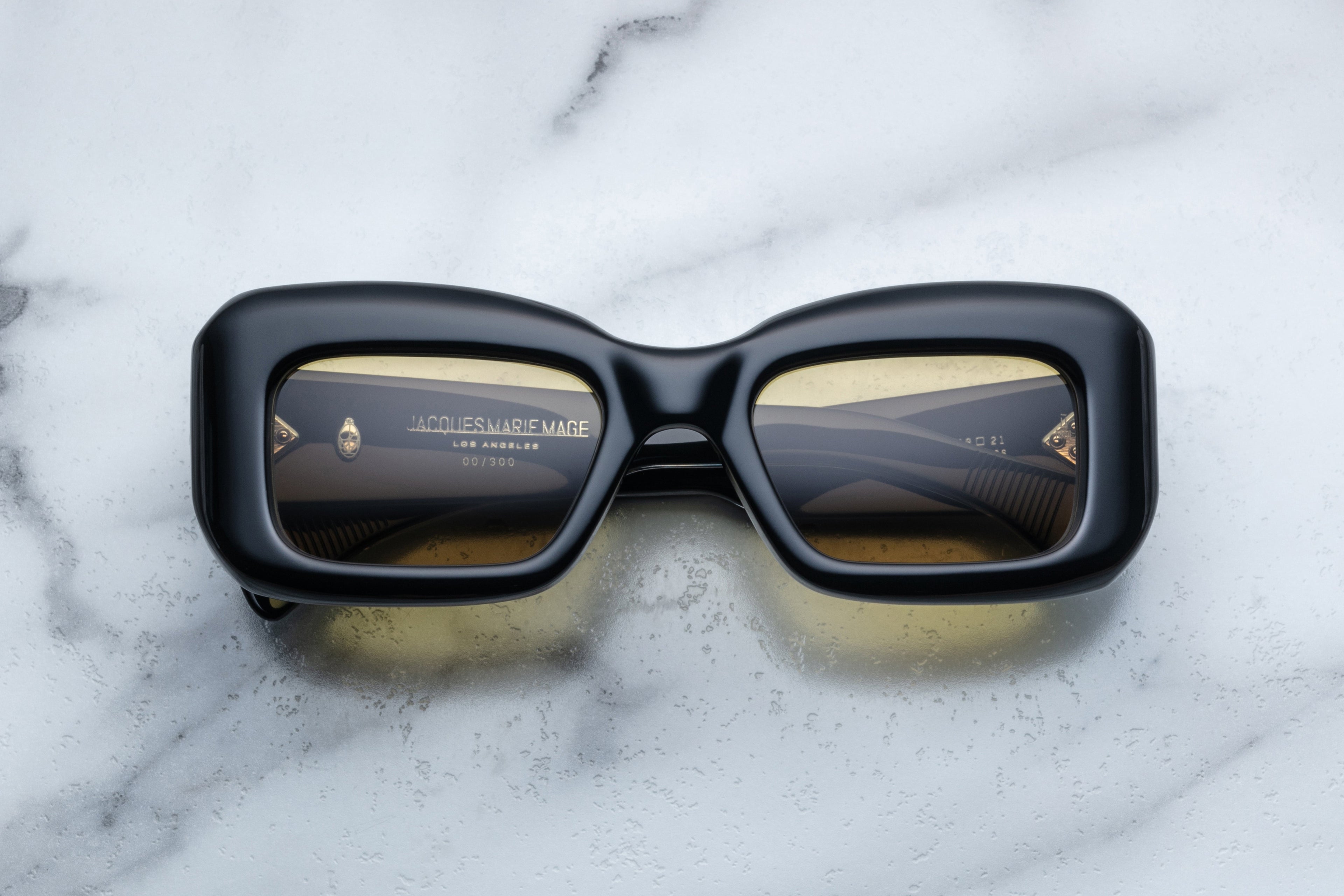 Jacques Marie Mage VITO sunglasses with shadowed front view showcasing sleek black frames and stylish design.
