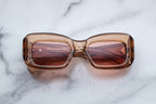 Jacques Marie Mage VITO sunglasses in tan with rounded frames and dark lenses, front view showing stylish eyewear design.