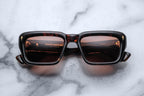 Jacques Marie Mage Walker sunglasses featuring dark tinted lenses and sleek black frames, front view.
