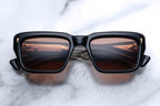Jacques Marie Mage Walker Beluga sunglasses with black frame and clear lenses, front view showing stylish design.