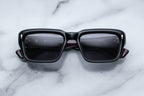 Jacques Marie Mage Walker Bloodstone sunglasses with rounded frame and dark tinted lenses, front view.