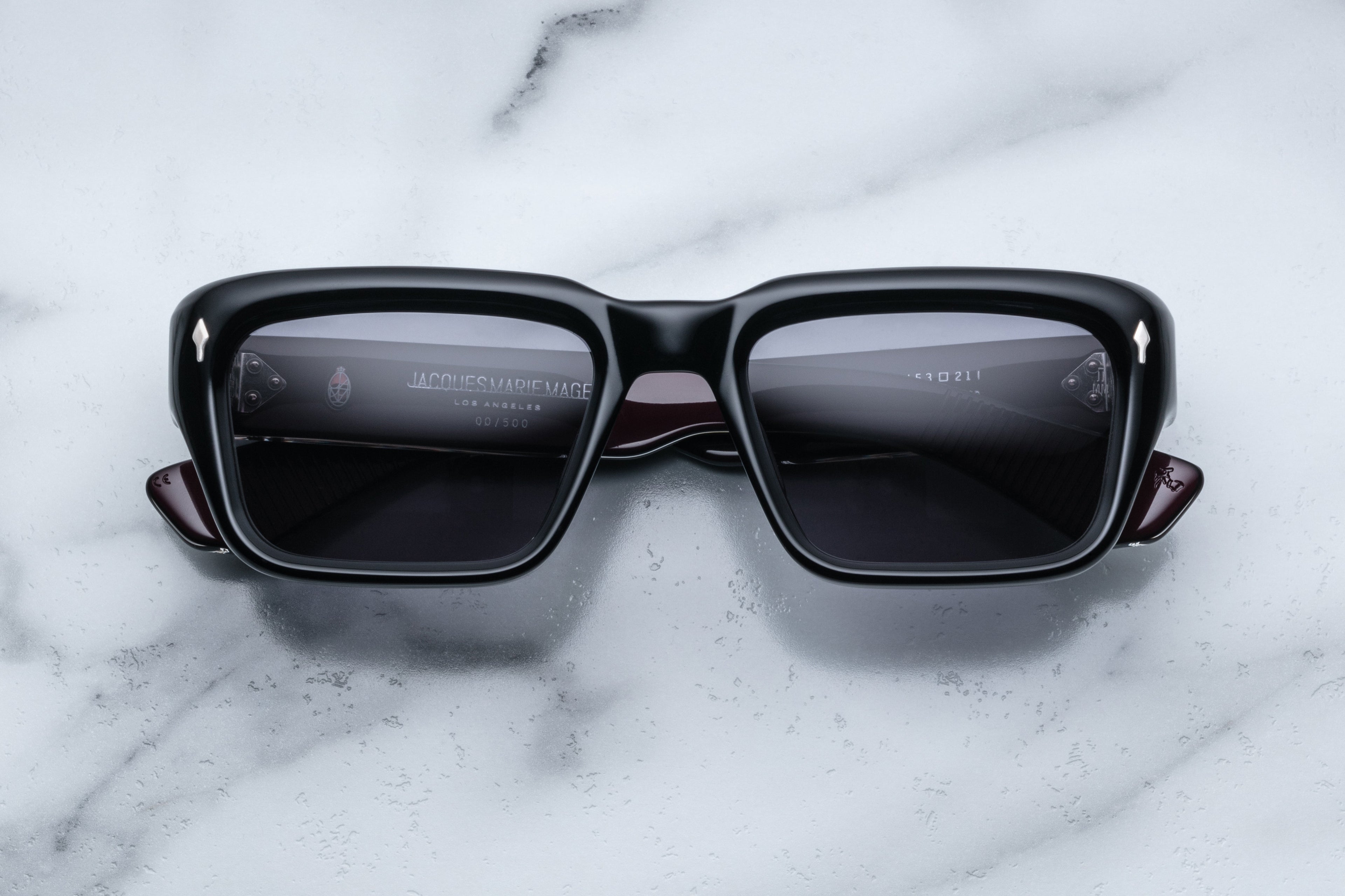 Jacques Marie Mage Walker Bloodstone sunglasses with rounded frame and dark tinted lenses, front view.