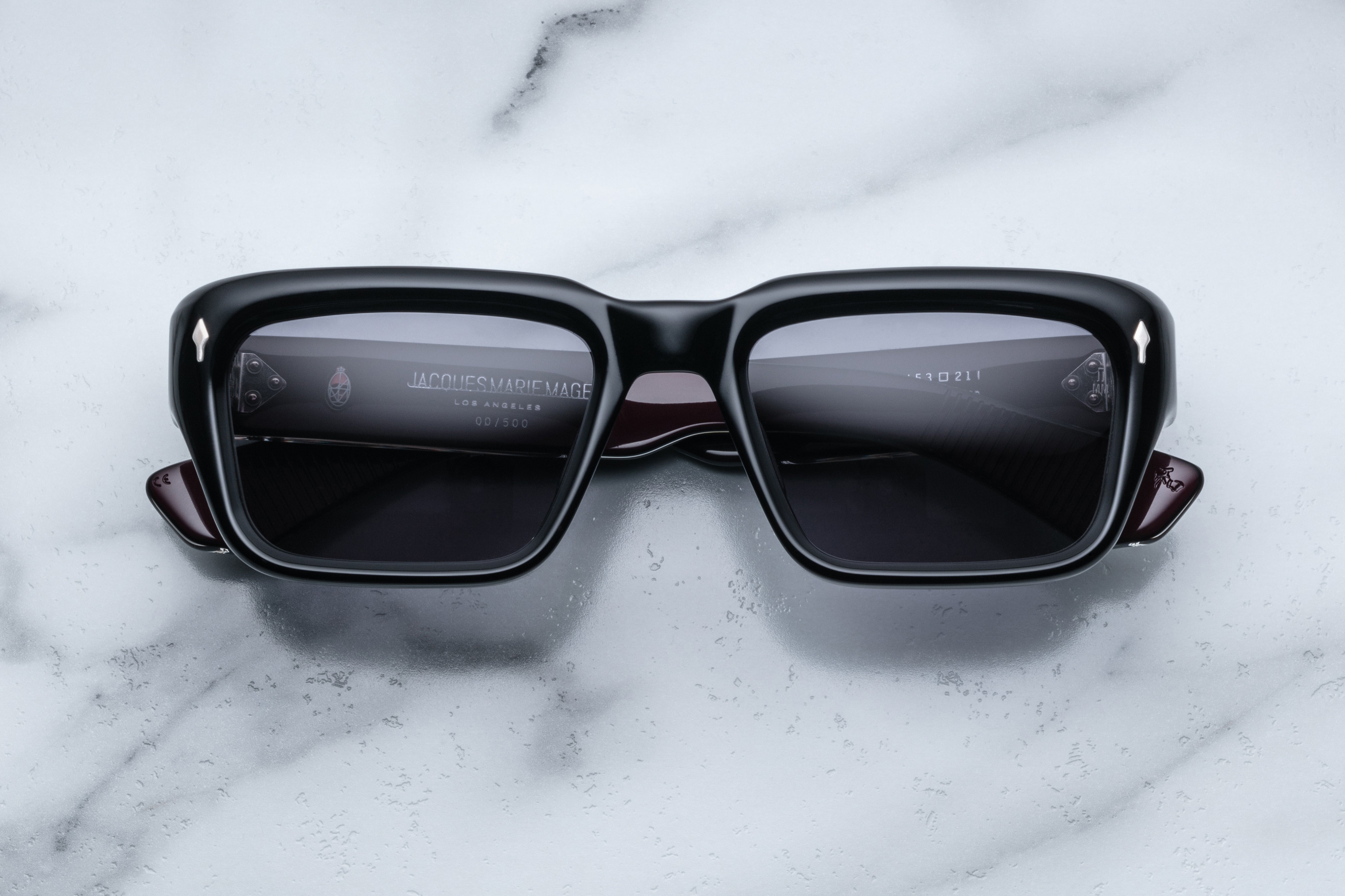 Jacques Marie Mage Walker Bloodstone sunglasses with rounded frame and dark tinted lenses, front view.