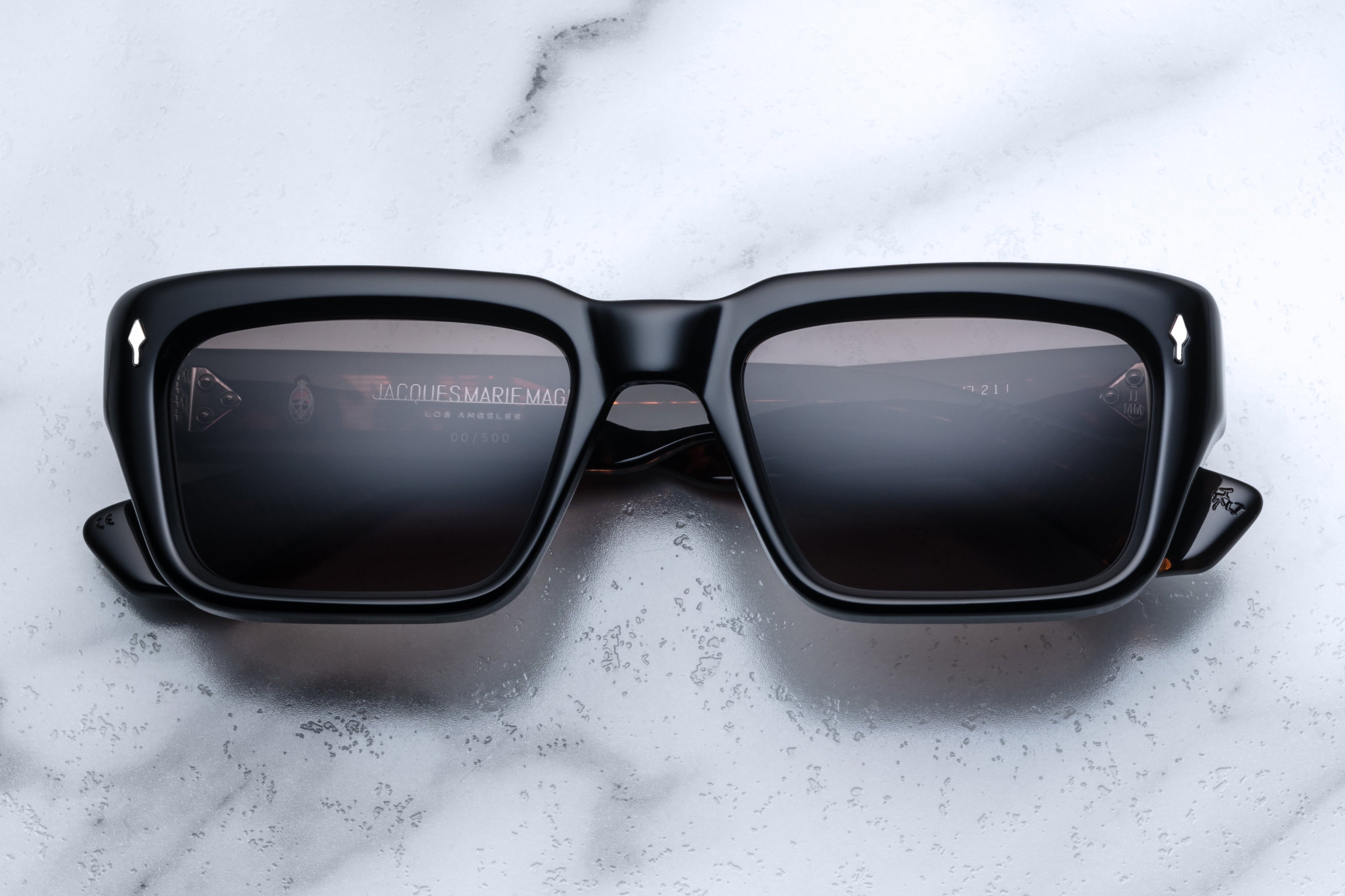 Jacques Marie Mage Walker Noir sunglasses with black frames and clear lenses, shown from the front view.