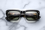 Jacques Marie Mage Walker sunglasses in noir with round frames and metal accents, shown from the front.