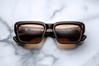 Jacques Marie Mage Walker sunglasses with walnut-colored frames, front view showing sleek, stylish design and tinted lenses.