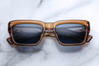 Jacques Marie Mage Walker whiskey sunglasses with round frames and tinted lenses, front view showing stylish design.