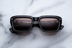 Jacques Marie Mage Walker sunglasses with willow-colored frames and clear lenses, front view showing stylish eyewear design.