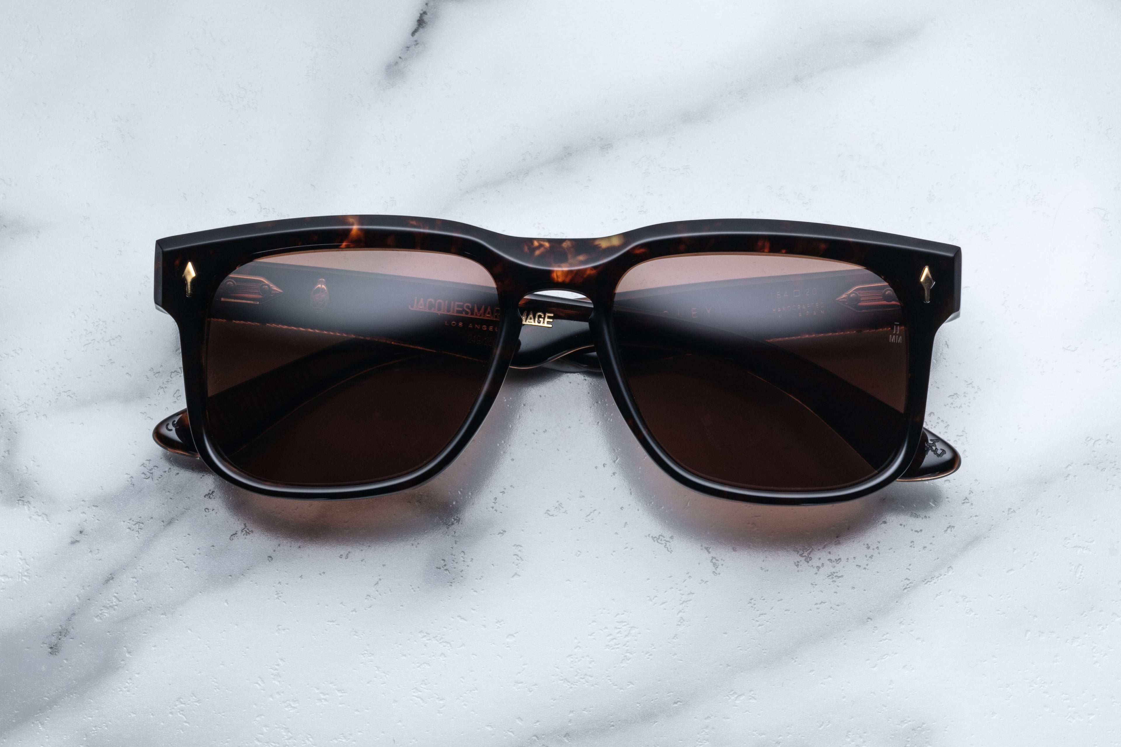 Jacques Marie Mage Wesley sunglasses with transparent agar-colored frames and clear lenses, shown from the front view.