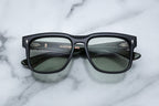 Jacques Marie Mage Wesley sunglasses with bold cobra-patterned frames and clear lenses, front view showing stylish design.