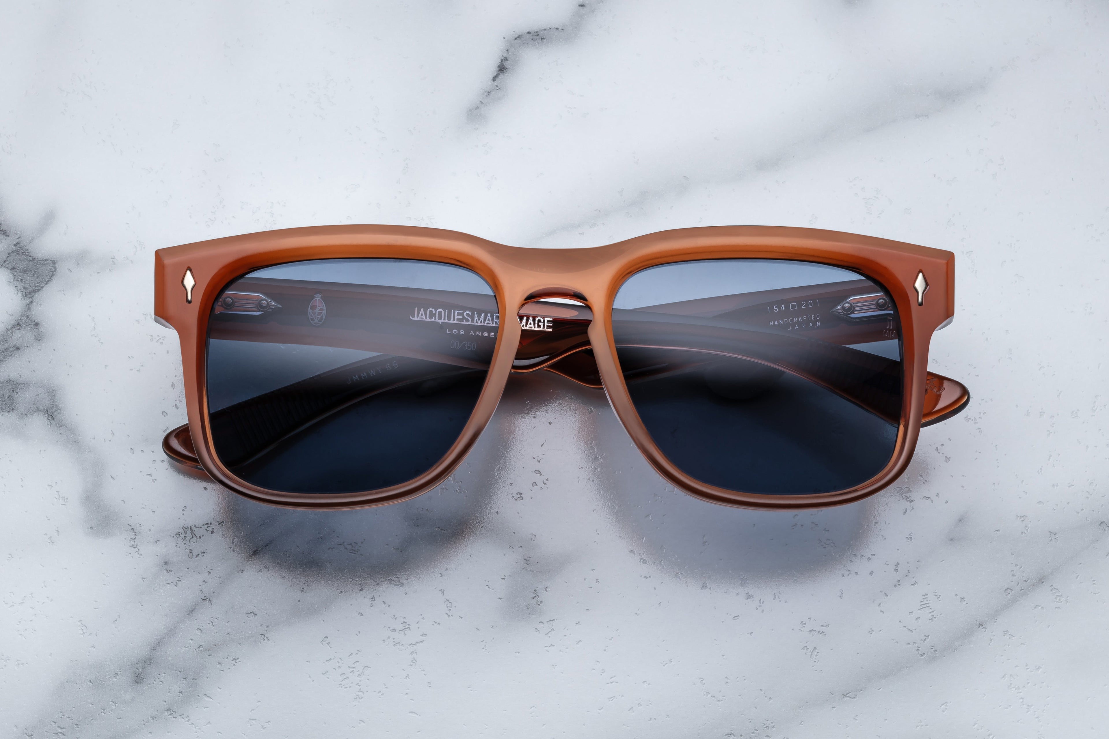 Jacques Marie Mage Wesley sunglasses with tortoise-shell frames and dark tinted lenses, front view showing stylish design.