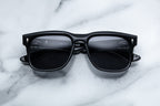 Jacques Marie Mage Wesley sunglasses with shadow-tinted lenses and sleek black frames, front view.