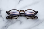 Jacques Marie Mage Zephirin optical glasses with hazel frames and clear lenses, front view showcasing sleek design and craftsmanship.