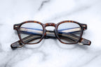 Optical Zephirin glasses by Jacques Marie Mage with argyle pattern on the front, showcasing stylish frame detail and clear lenses.