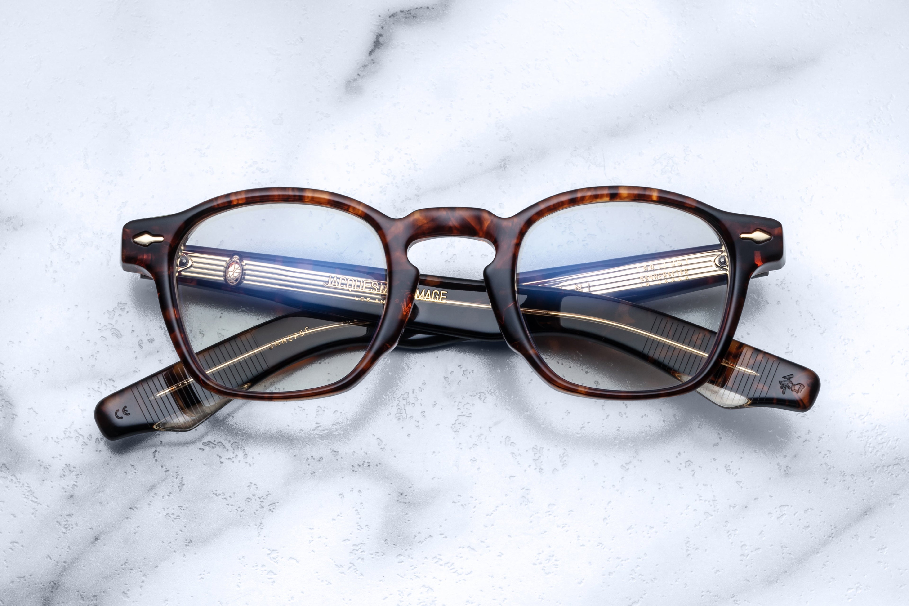Optical Zephirin glasses by Jacques Marie Mage with argyle pattern on the front, showcasing stylish frame detail and clear lenses.
