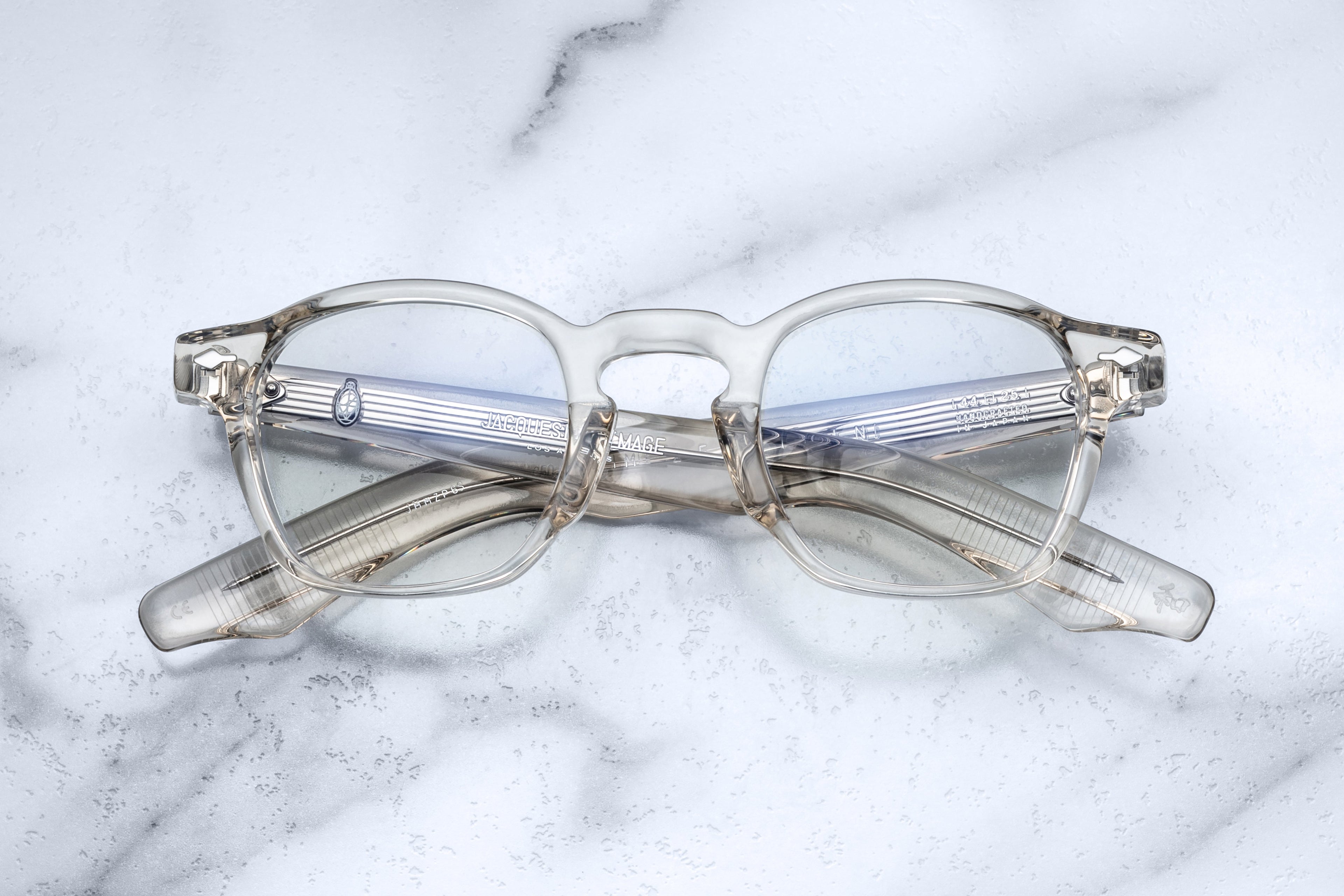 Jacques Marie Mage Zephirin beige optical glasses with round frames and clear lenses, front view.