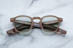 Jacques Marie Mage Zephirin sunglasses with birch-colored frames and dark tinted lenses, front view showcasing stylish design.