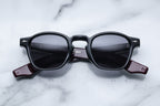 Jacques Marie Mage Zephirin Bloodstone sunglasses with bold frames and tinted lenses, front view showing intricate design details.