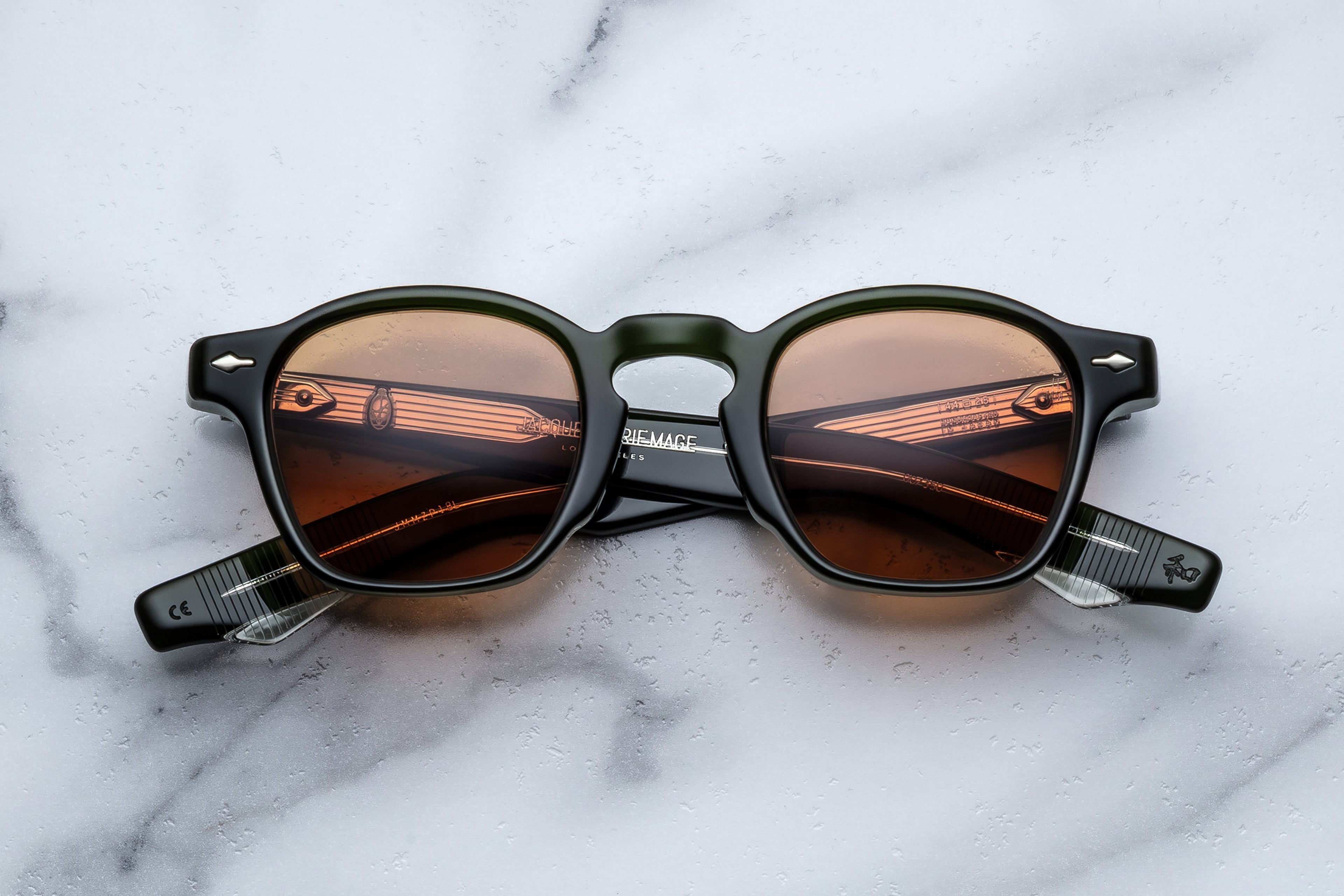 Jacques Marie Mage Zephirin Borneo sunglasses with rounded frames and dark lenses, front view showing stylish design.