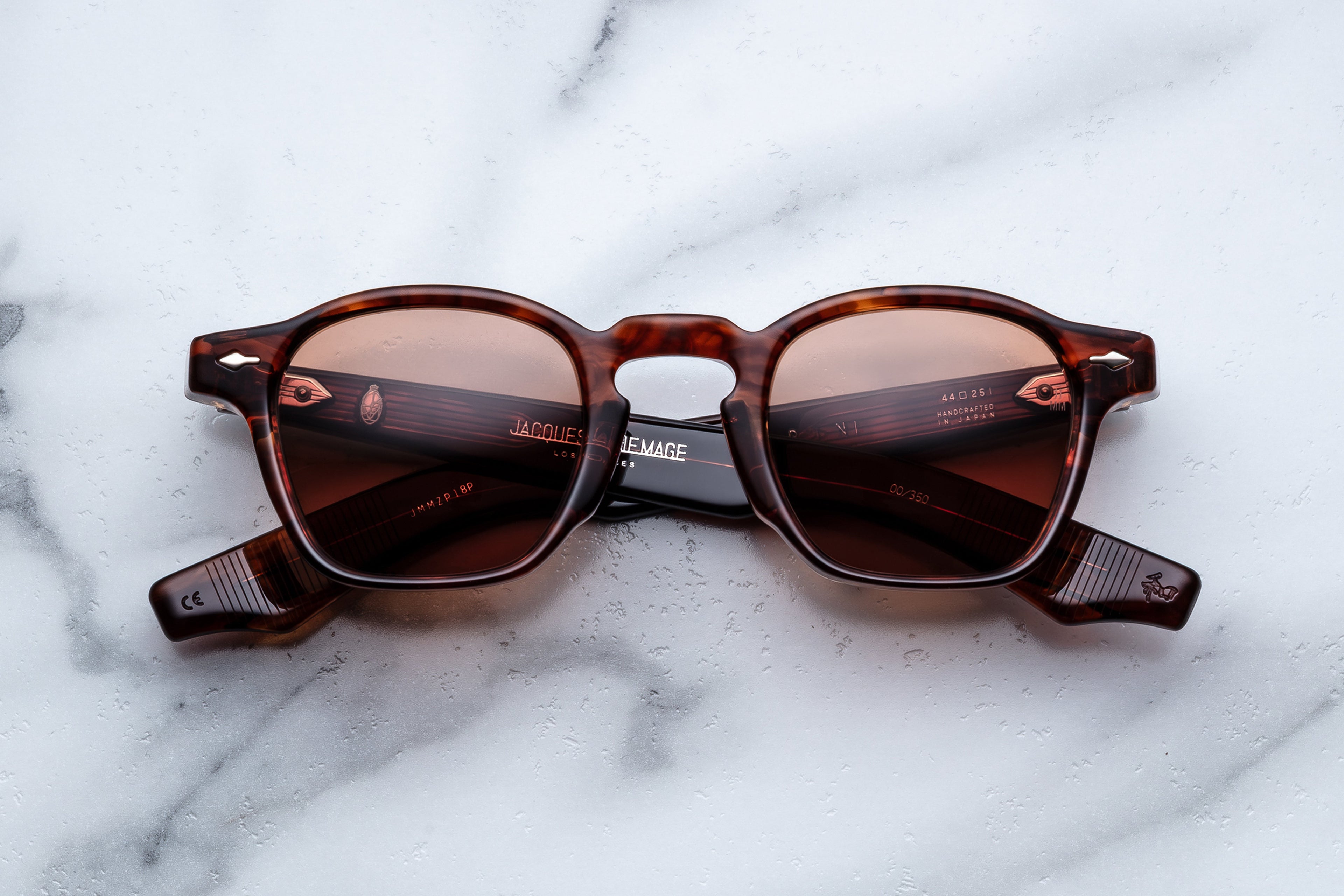 Jacques Marie Mage Zephirin Bourbon sunglasses with rounded frames and dark tinted lenses, front view showing stylish design.