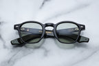 Jacques Marie Mage Zephirin sunglasses with sleek black frames and tinted lenses, front view showing modern design details.