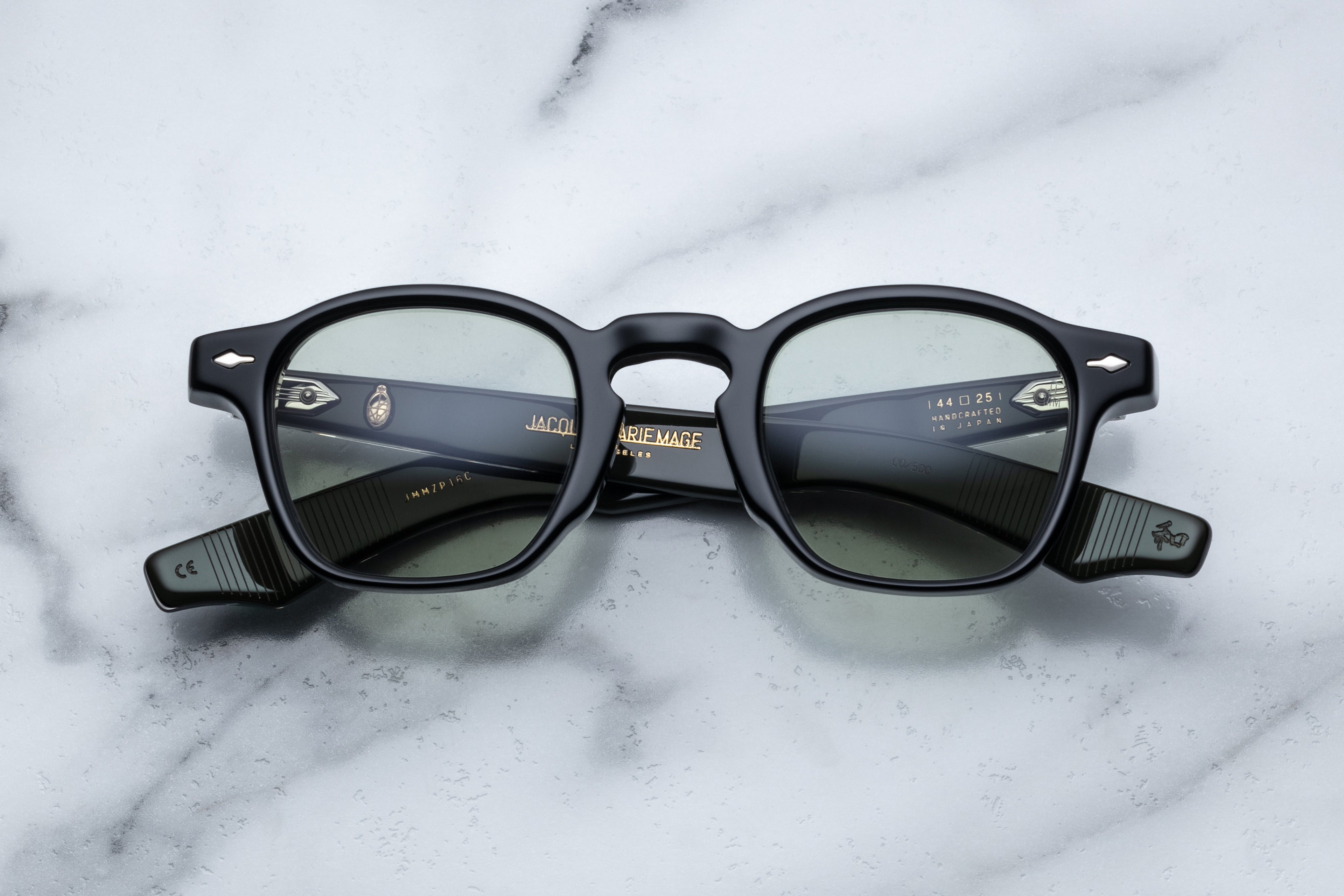 Jacques Marie Mage Zephirin sunglasses with sleek black frames and tinted lenses, front view showing modern design details.