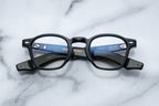 Jacques Marie Mage Zephirin Cobra RX optical glasses with round black frames and clear lenses, front view showing detailed design.
