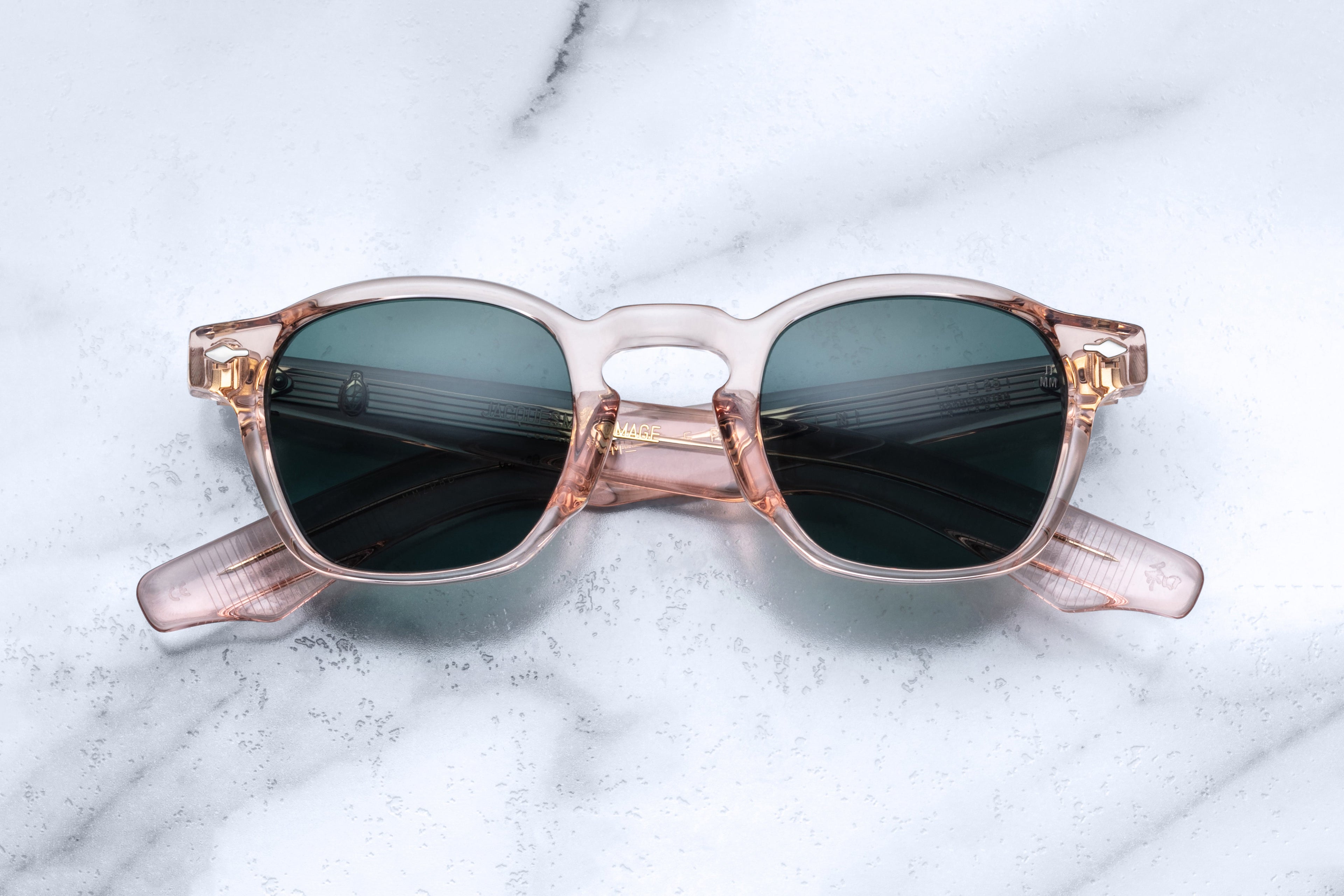 Jacques Marie Mage Zephirin Dahlia sunglasses with round frames and dark tinted lenses, front view.