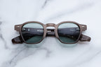 Jacques Marie Mage Zephirin sunglasses in dusty jade with a front view, showcasing sleek design and tinted lenses.