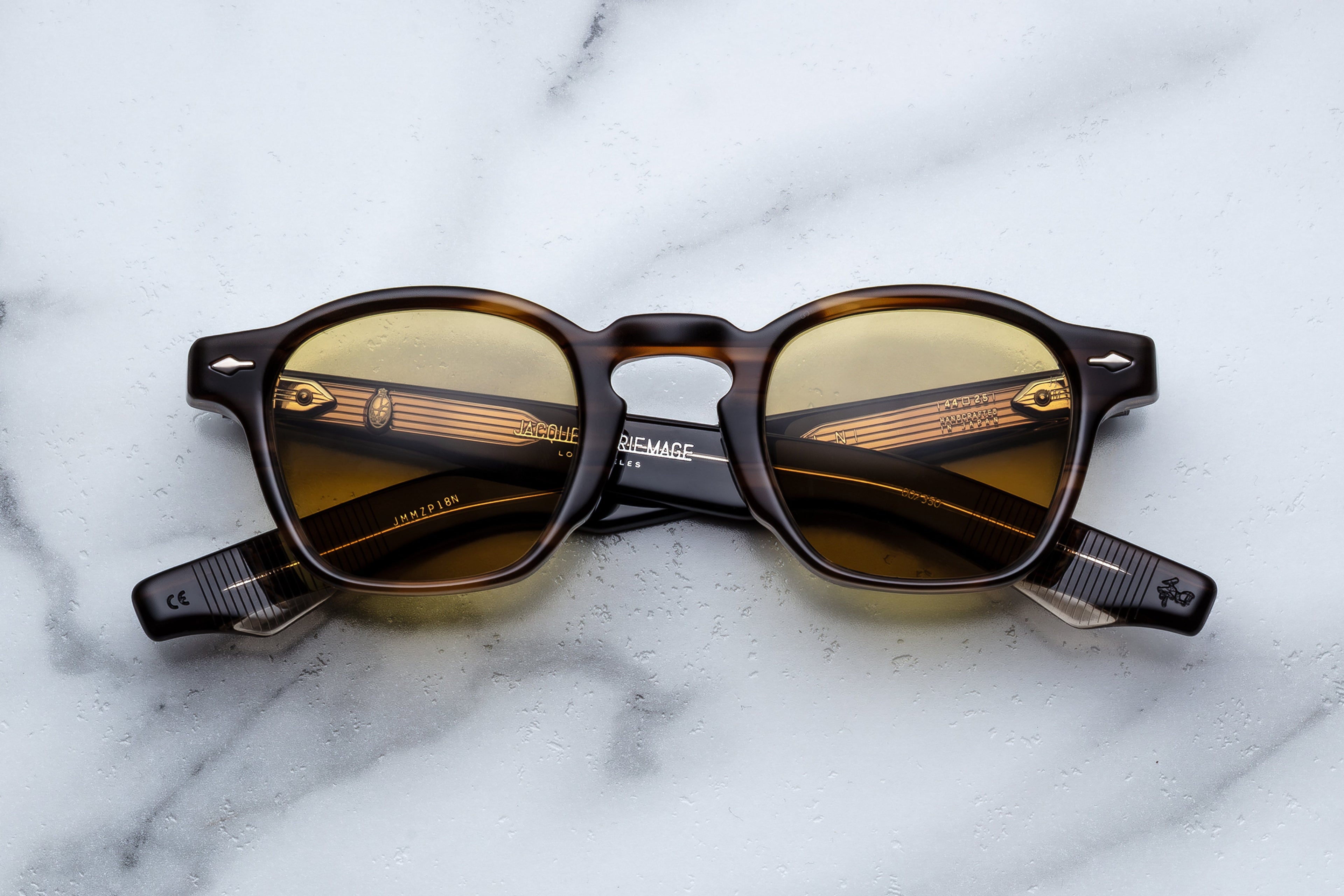 Jacques Marie Mage Zephirin Hazel sunglasses with round frames and tinted lenses, viewed from the front.