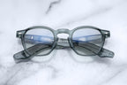 Jacques Marie Mage Zephirin optical glasses with juniper-colored frames, front view showcasing stylish design and clear lenses.